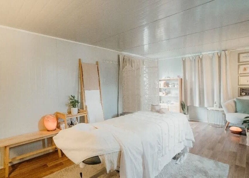 Relaxing treatment room at My Little Oasis, Palmerston North, Manawatū-whanganui, NZ, with cozy decor and soft lighting.