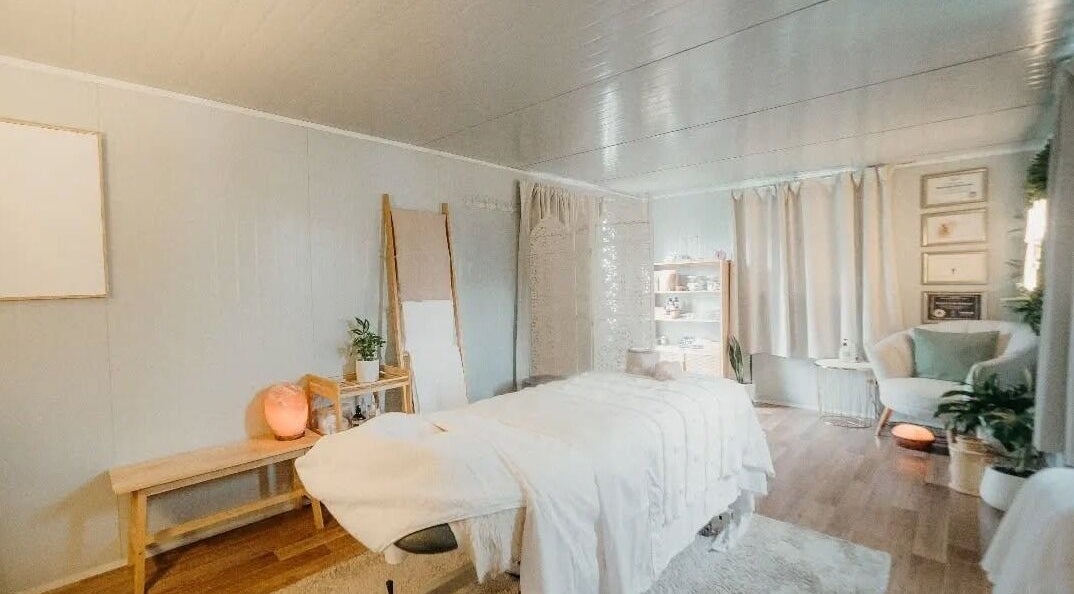 Relaxing treatment room at My Little Oasis, Palmerston North, Manawatū-whanganui, NZ, with cozy decor and soft lighting.