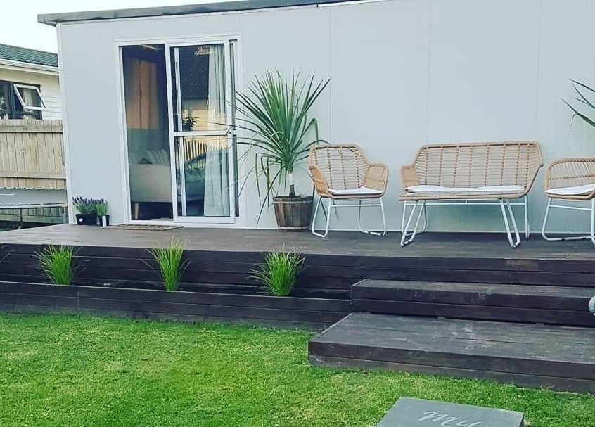Charming garden seating at My Little Oasis, Palmerston North, Manawatū-whanganui, NZ.