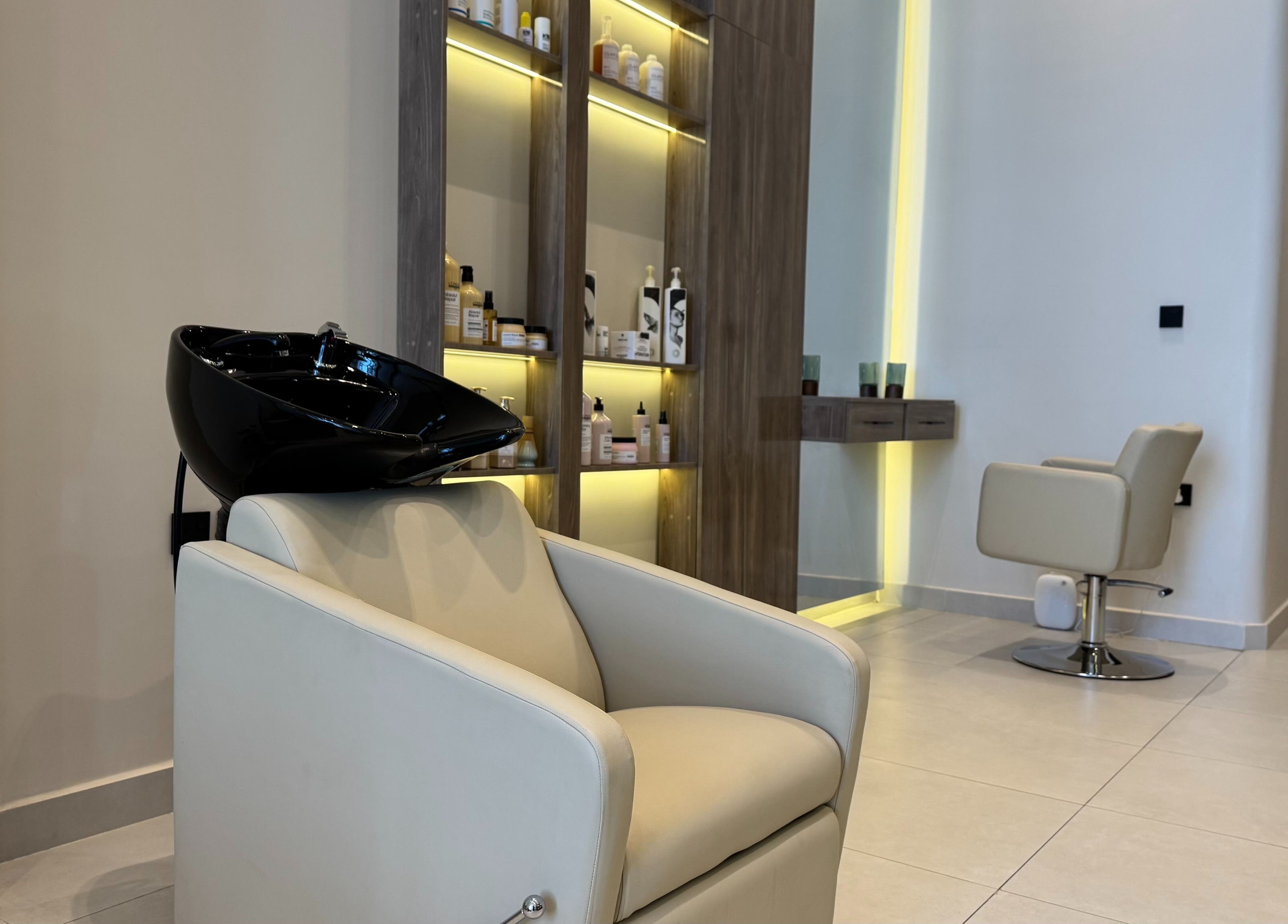 Elegant spa chair and wash station at So Spa, Riyadh, Riyadh Province, SA, showcasing modern design.