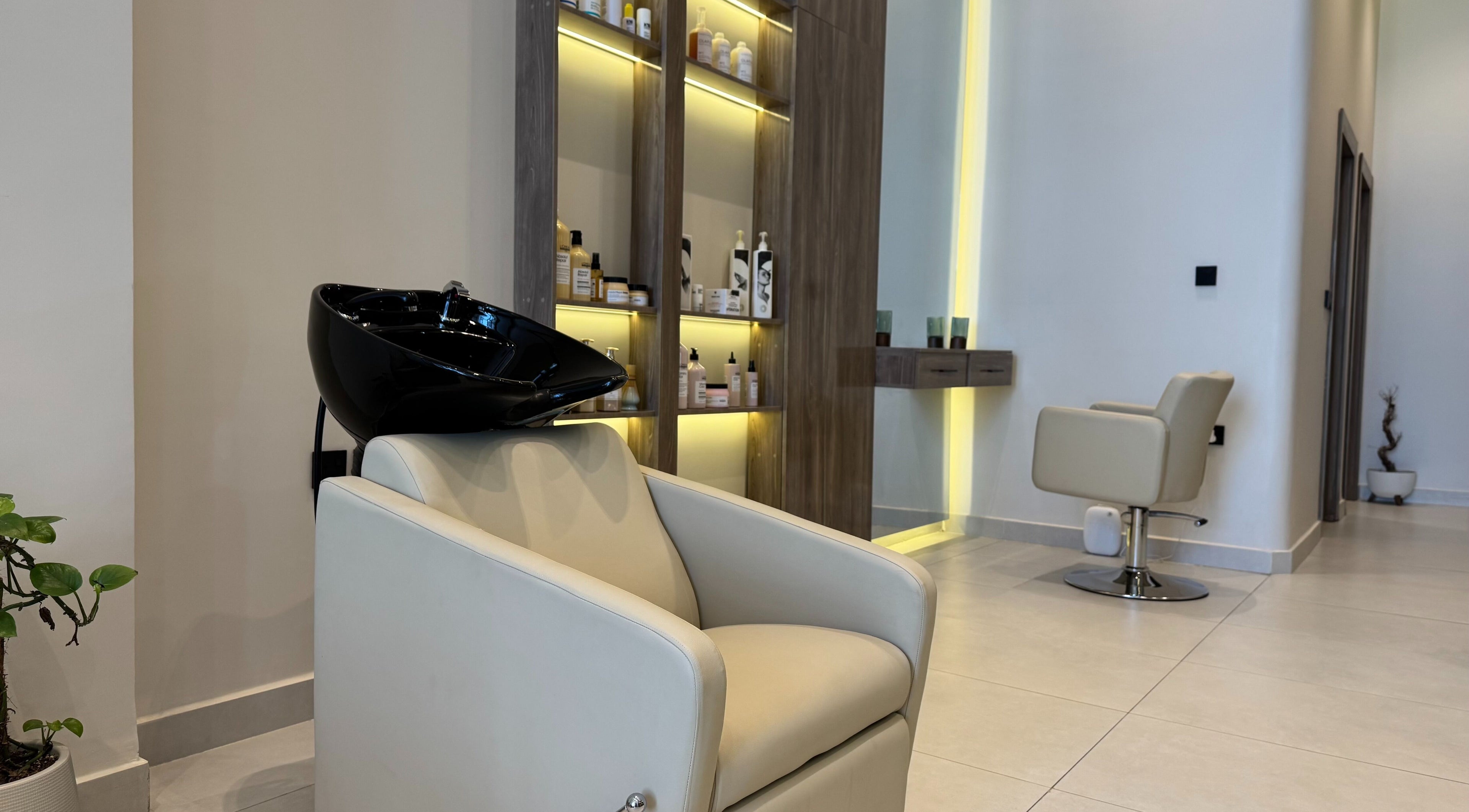 Elegant spa chair and wash station at So Spa, Riyadh, Riyadh Province, SA, showcasing modern design.
