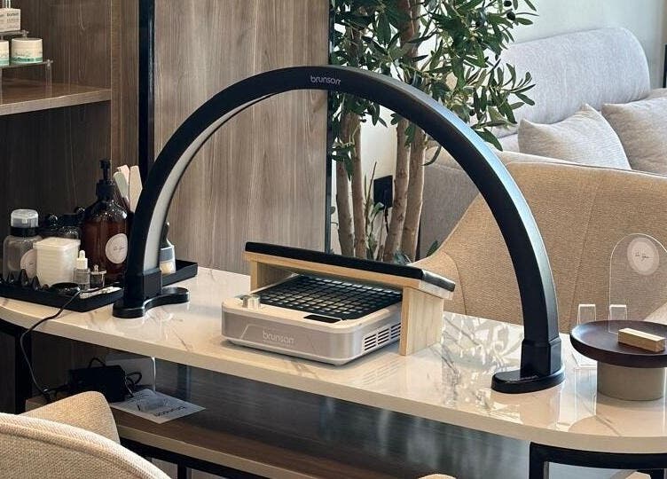 Elegant nail care station at So Spa, Riyadh, Riyadh Province, SA, featuring modern tools and cozy decor.