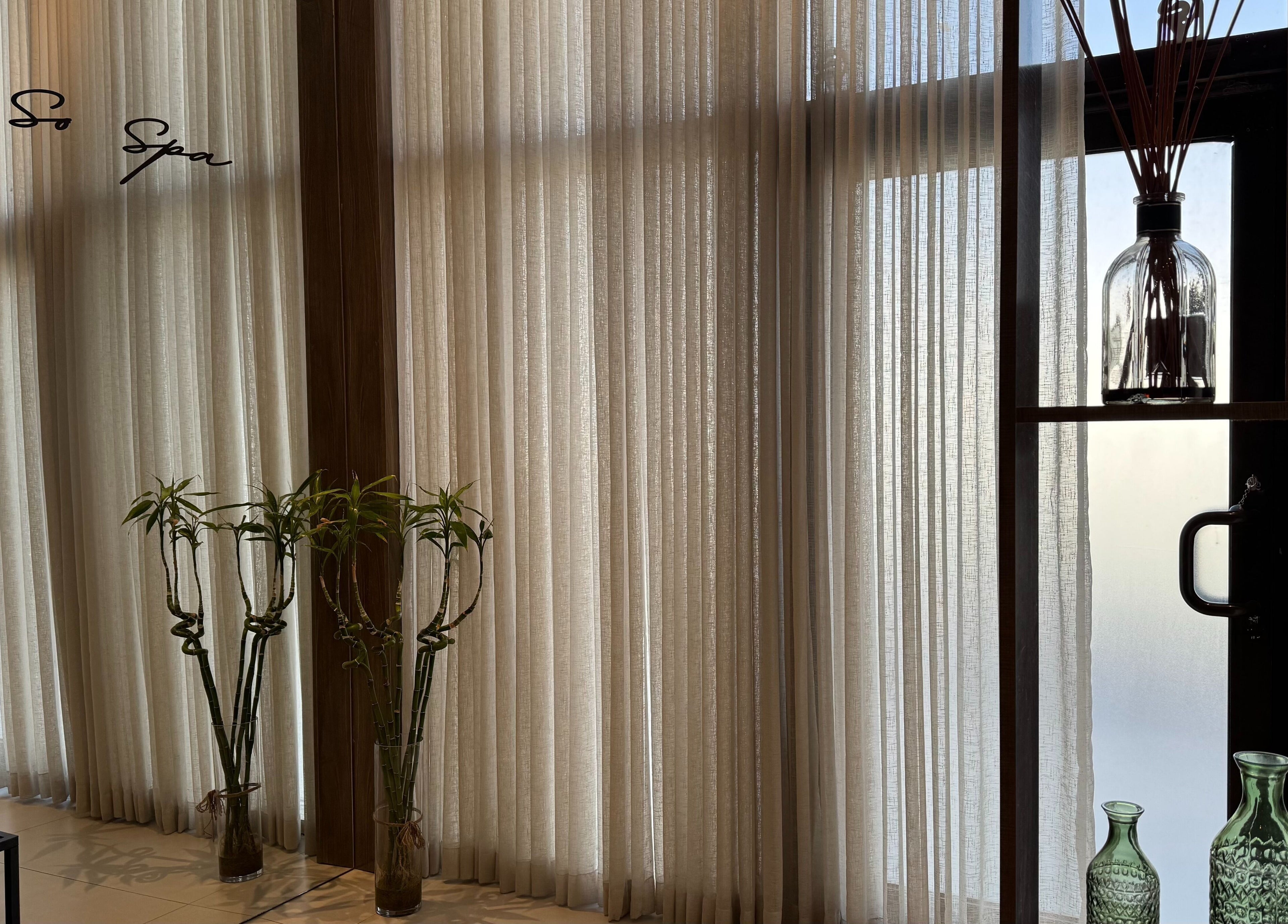 Elegant interior design with tall curtains and plants at So Spa in Riyadh, Riyadh Province, SA.