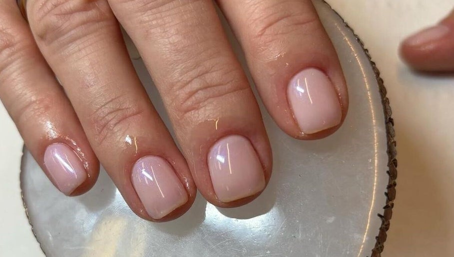Elegant manicure at Brazilian Glow, Dublin, County Dublin, IE. Light pink nails on a smooth surface.