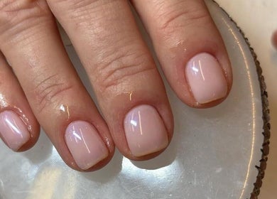 Elegant manicure at Brazilian Glow, Dublin, County Dublin, IE. Light pink nails on a smooth surface.