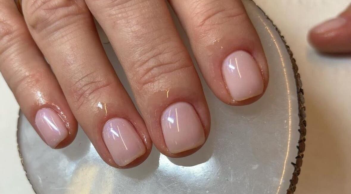 Elegant manicure at Brazilian Glow, Dublin, County Dublin, IE. Light pink nails on a smooth surface.