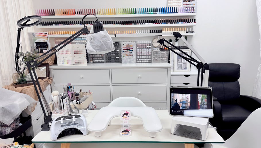 Niko Nail Studio, La Verne, California offers a sleek, modern nail station with vibrant polish displays.