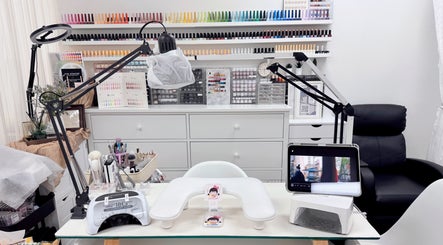 Niko Nail Studio, La Verne, California offers a sleek, modern nail station with vibrant polish displays.