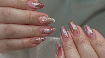 Elegant nail art with pink and gold accents at Niko Nail Studio, La Verne, California, US.