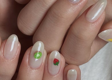 Colorful fruit nail art at Niko Nail Studio, La Verne, California, US; featuring cherries, kiwi, and strawberry designs.