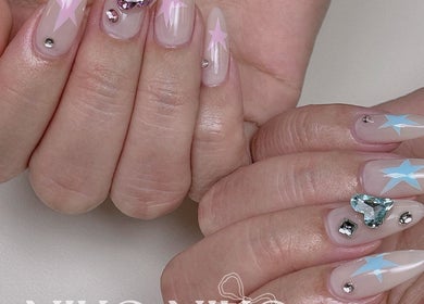 Starry gem-adorned nails at Niko Nail Studio, La Verne, California, US, showcasing chic nail art.