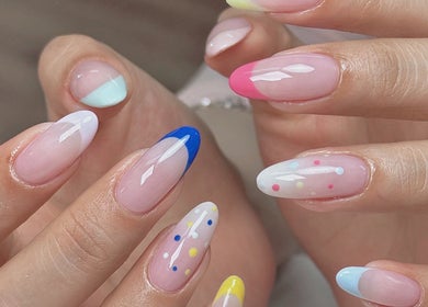 Vibrant nail art at Niko Nail Studio, La Verne, California, US, showcasing colorful and creative designs.