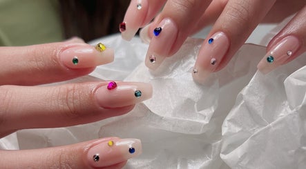 Stylish gem-adorned nails at Niko Nail Studio, La Verne, California, US.