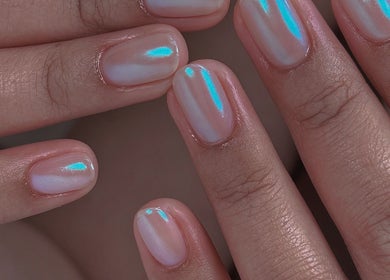 Iridescent nails at Niko Nail Studio, La Verne, California, US. Perfectly manicured with a pearly shine.