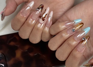 Detailed artistic nail designs at Niko Nail Studio, La Verne, California, US.