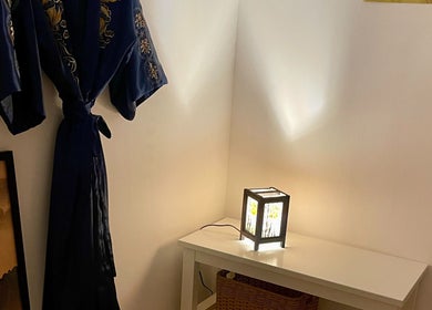 Elegant robe and lamp in Kobido Mallorca, Palma, Illes Balears, ES, creating a tranquil ambiance.