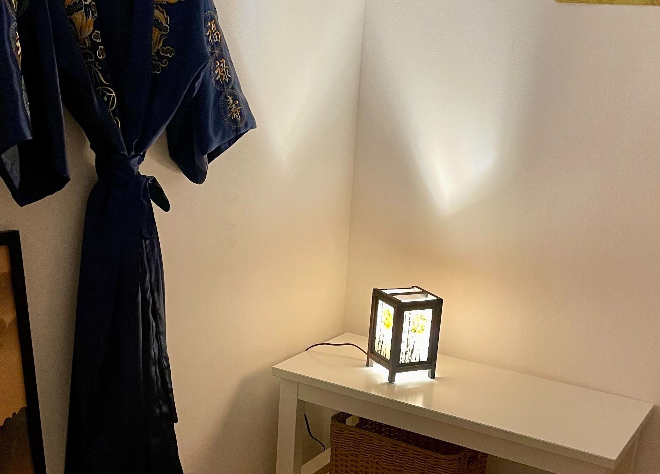 Cozy corner at Kobido Mallorca, Palma, Illes Balears, ES, featuring a decorative robe and ambient lantern.