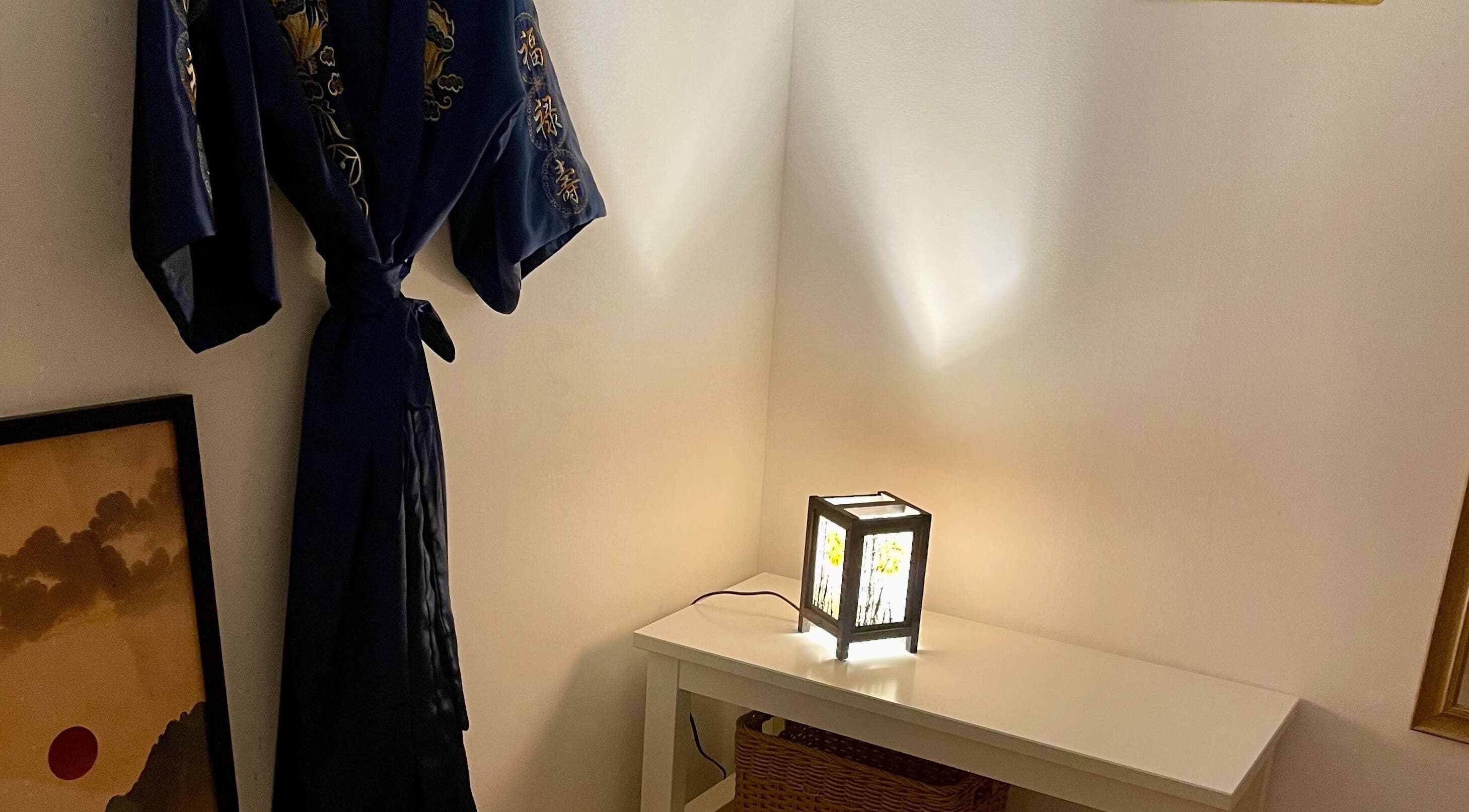 Cozy corner at Kobido Mallorca, Palma, Illes Balears, ES, featuring a decorative robe and ambient lantern.