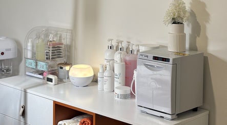 Modern beauty setup at Comfy Lashes, Canberra, Australian Capital Territory, AU, showcasing skincare products and tools.