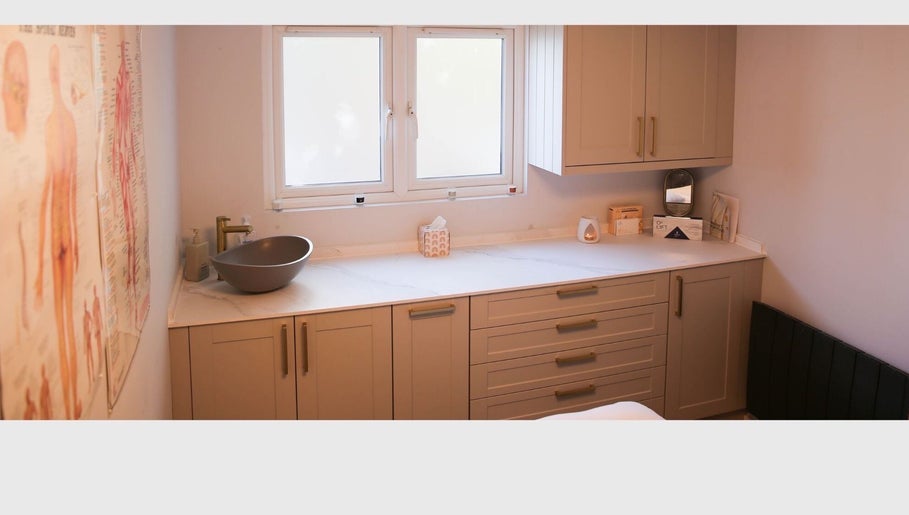 Serene therapy room at Revitalizetherapies with calming decor and modern sink in Carlton Colville, England, GB.