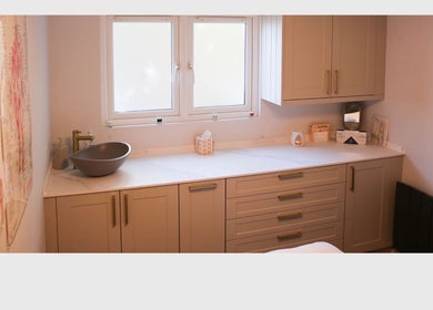 Serene therapy room at Revitalizetherapies with calming decor and modern sink in Carlton Colville, England, GB.