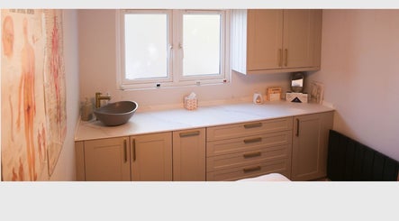 Serene therapy room at Revitalizetherapies with calming decor and modern sink in Carlton Colville, England, GB.