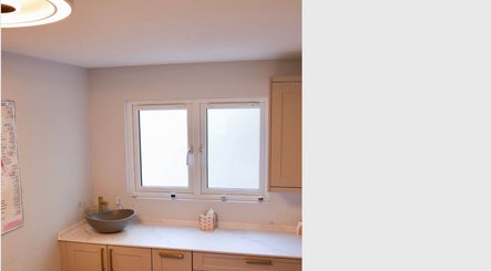 Modern washbasin and minimalistic decor at Revitalizetherapies, Carlton Colville, England, GB.