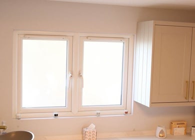 Bright, modern bathroom sink at Revitalizetherapies, Carlton Colville, England, GB, under a sunny window.