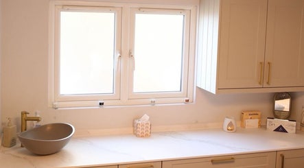 Elegant countertop and sink at Revitalizetherapies, Carlton Colville, England, GB, creating a calming ambiance.