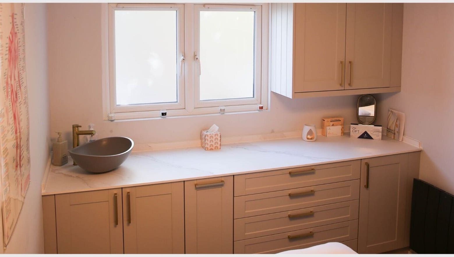Elegant spa counter at Revitalizetherapies, Carlton Colville, England, GB, with basin and soothing decor.