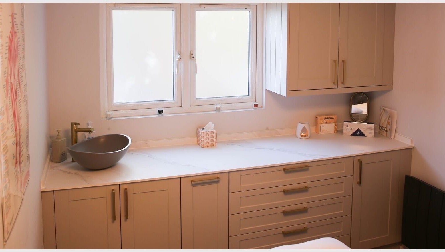 Elegant spa counter at Revitalizetherapies, Carlton Colville, England, GB, with basin and soothing decor.