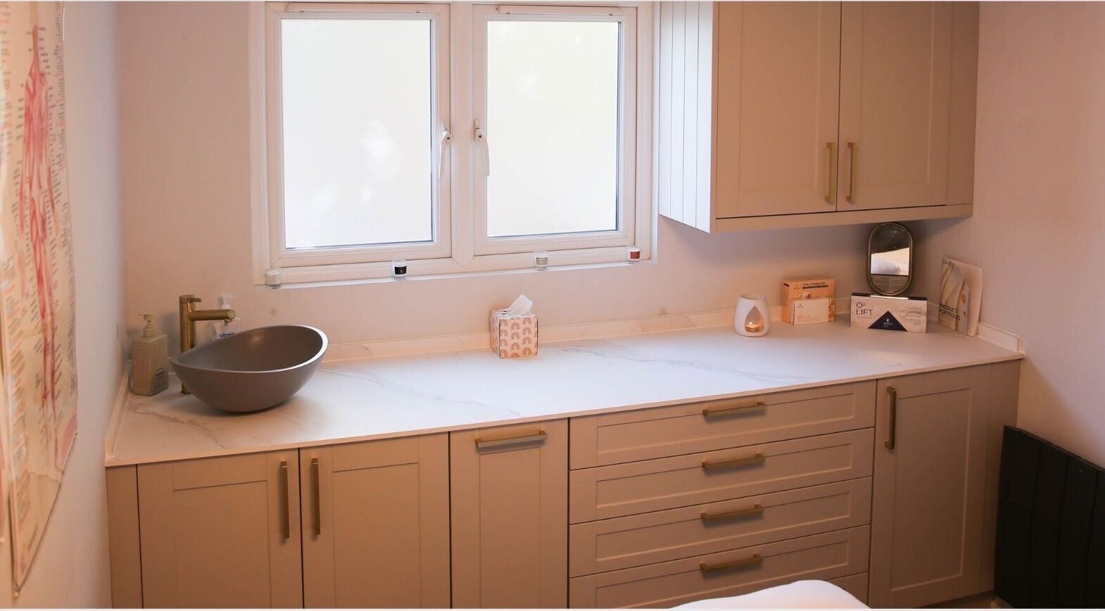 Elegant spa counter at Revitalizetherapies, Carlton Colville, England, GB, with basin and soothing decor.