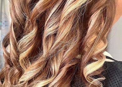 Golden blonde curls styled at Heavenly Hair, Dudley Park, Western Australia, AU.
