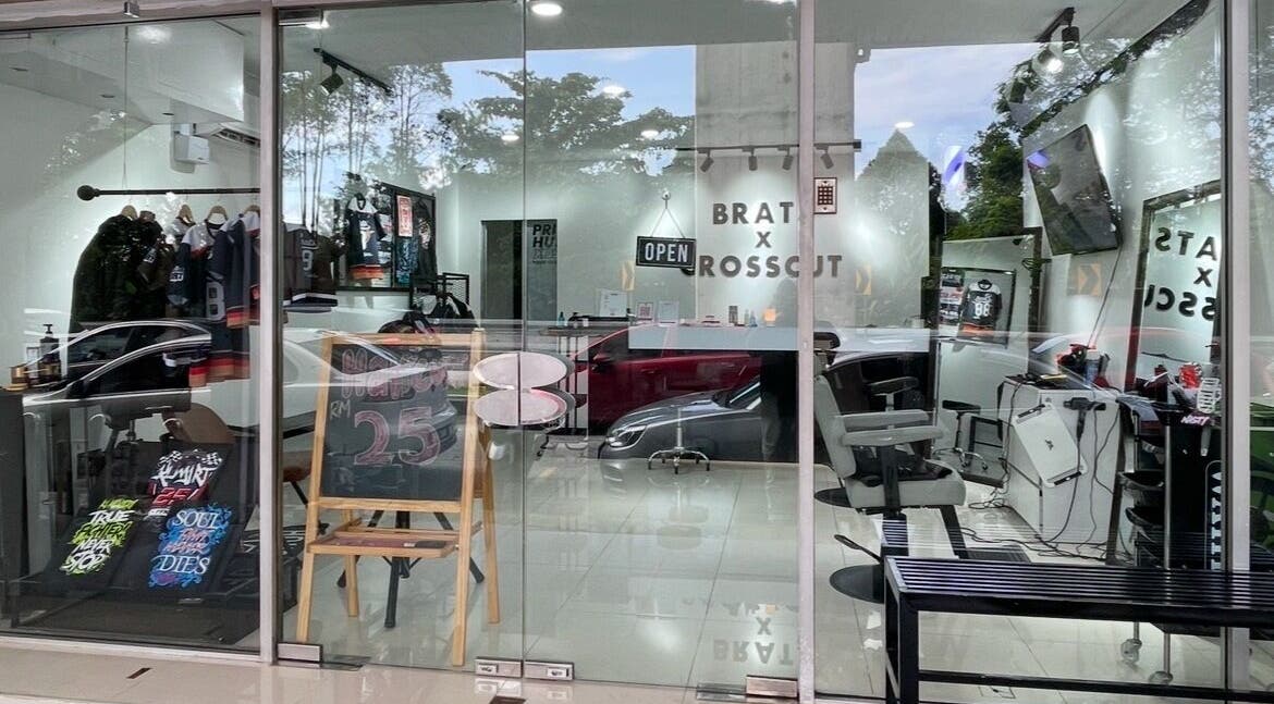 Chic interior of CROSSCUT BARBERS at Kuala Lumpur, Wilayah Persekutuan Kuala Lumpur, MY with stylish decor.