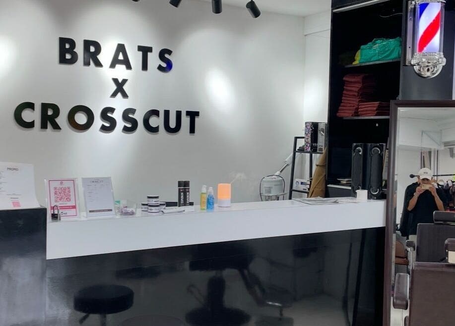 Interior of CROSSCUT BARBERS in Kuala Lumpur with modern decor and barber amenities.
