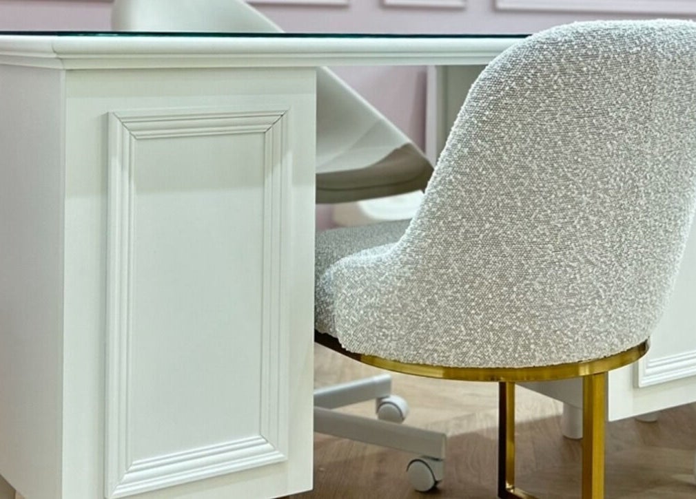 Chic nail salon workspace at Nailsbyklc, Monton, England, GB with stylish white chairs and desk.