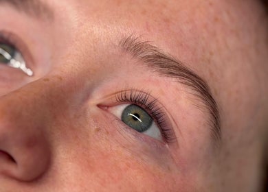 Close-up of a woman's eye with perfectly groomed brows at Defined by Amy Jane, Altrincham, England, GB.