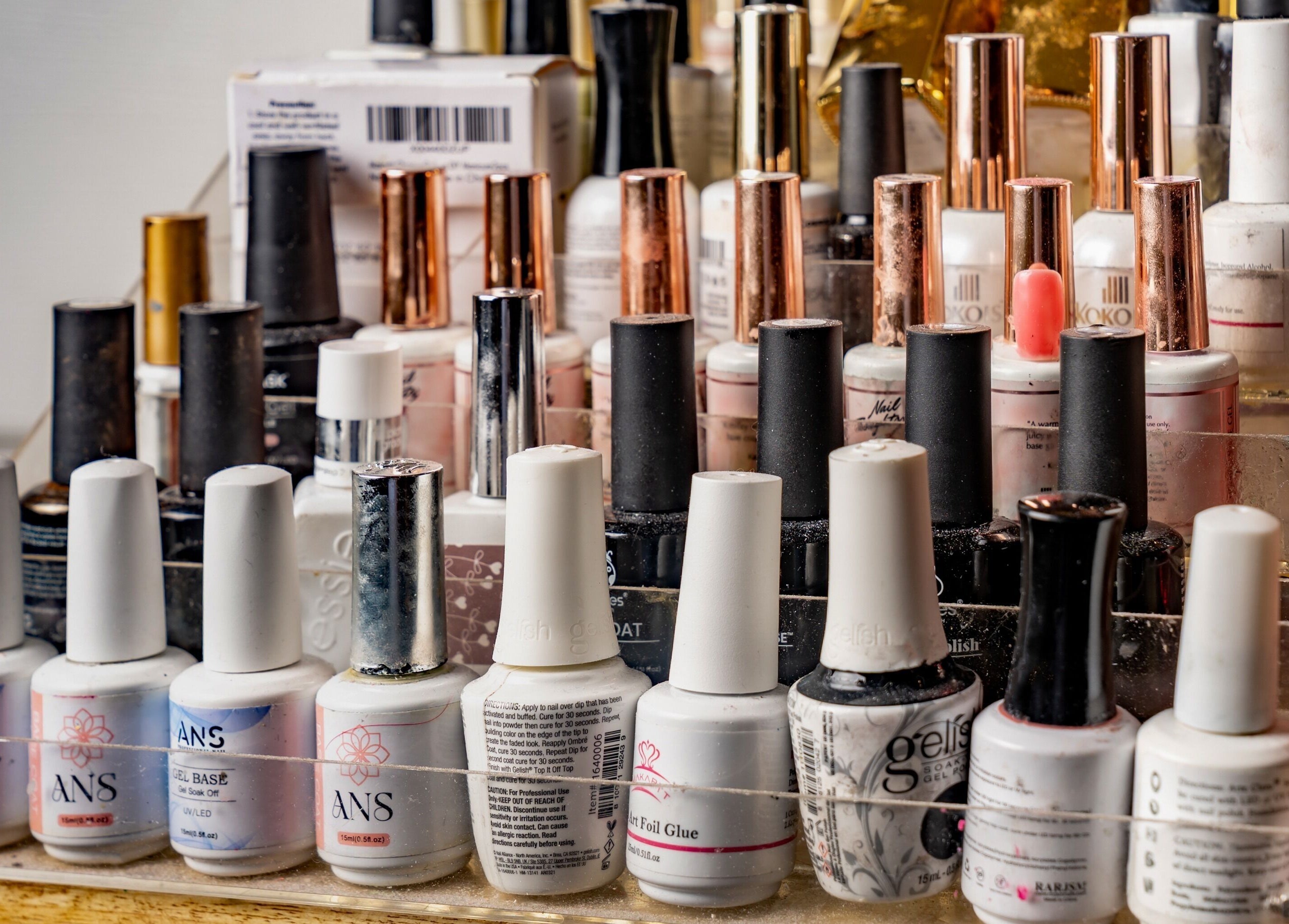 Varied nail polish bottles displayed at Pick A Color Studio, New York, New York, US.