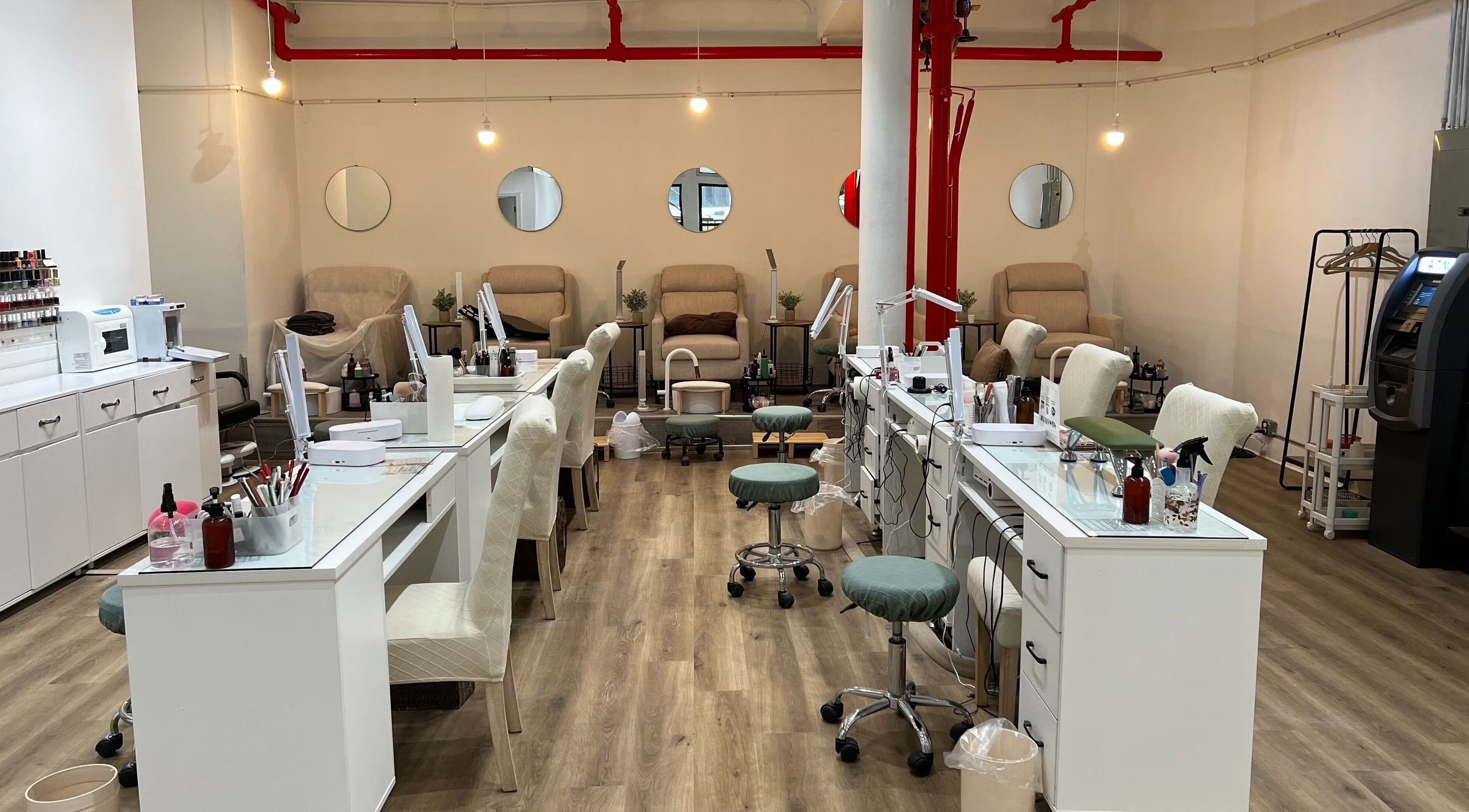 Interior view of Pick A Color Studio Color Hub (Bed Of Nails Beauty) in New York, New York, US showing nail stations.