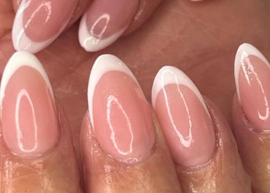 Close-up of elegant French manicure nails done at Lady Nails in Taupō, Waikato, NZ, showcasing perfect styling.