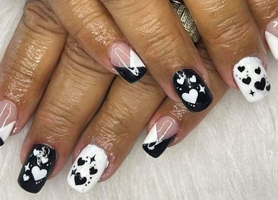 Black and white heart nail art at Lady Nails, Taupō, Waikato, NZ, showcasing elegant and creative designs.