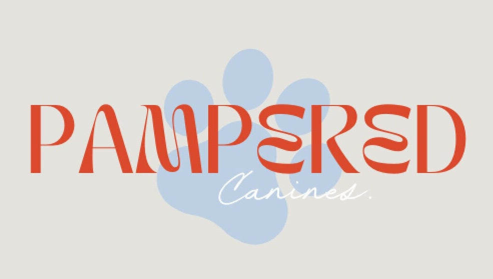 Logo of Pampered Canines at Melbourne, Victoria, AU with red text and blue paw print.
