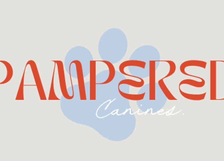 Logo of Pampered Canines at Melbourne, Victoria, AU with red text and blue paw print.