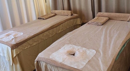 Relaxing massage beds at Oaken in Singapore, SG offer a tranquil spa experience.