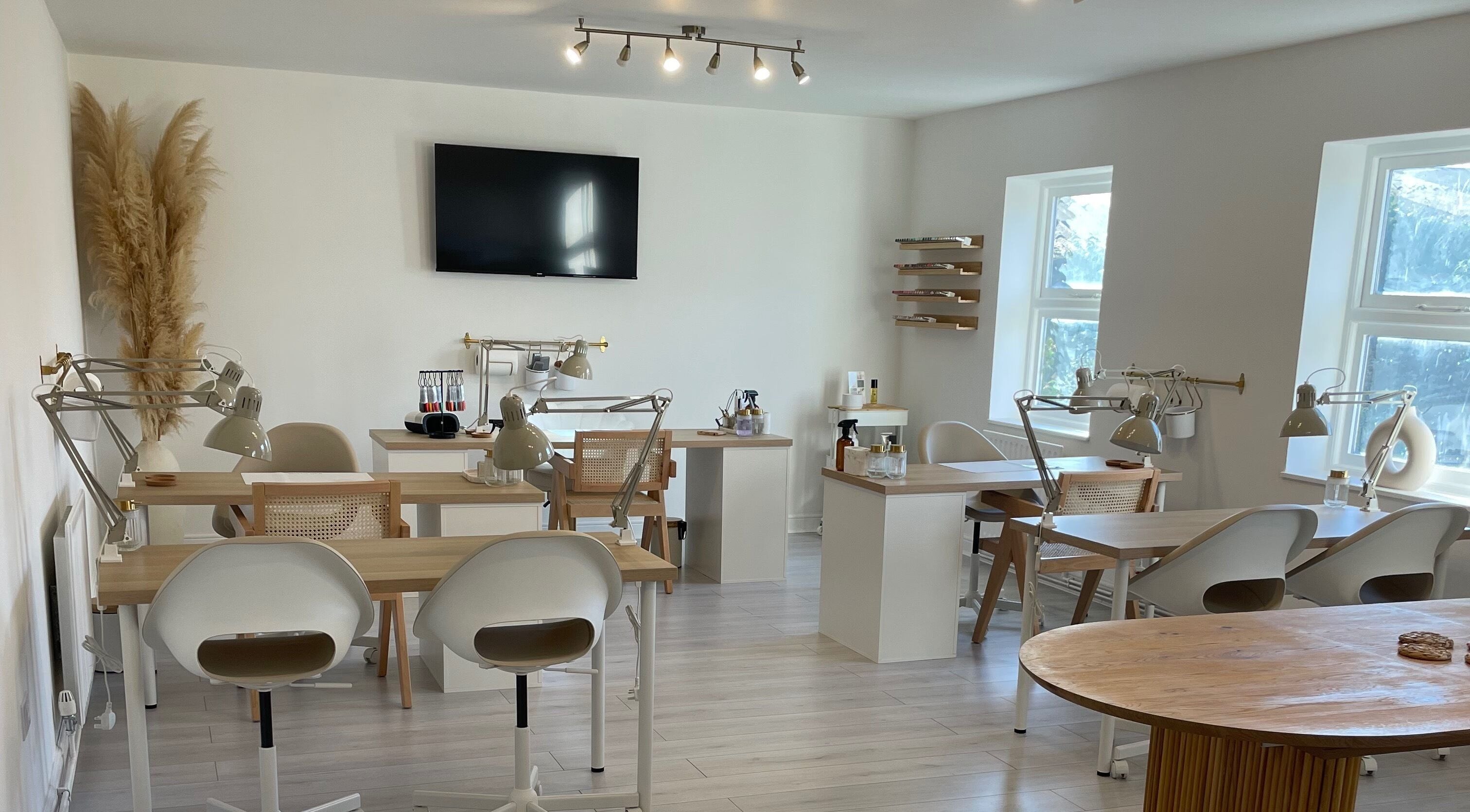 Modern interior of Pampa Nail Salon & Training Academy, Rotherham, England, GB featuring sleek workstations.