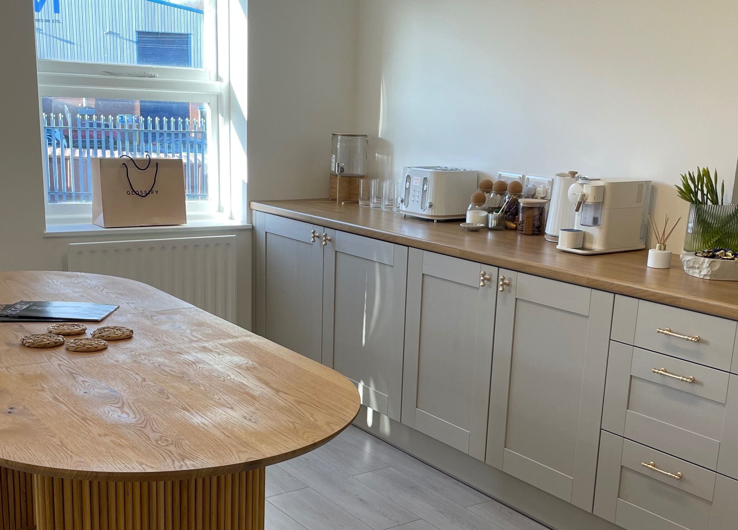 Cozy breakroom at Pampa Nail Salon & Training Academy, Rotherham, England, GB with sleek cabinets and inviting decor.