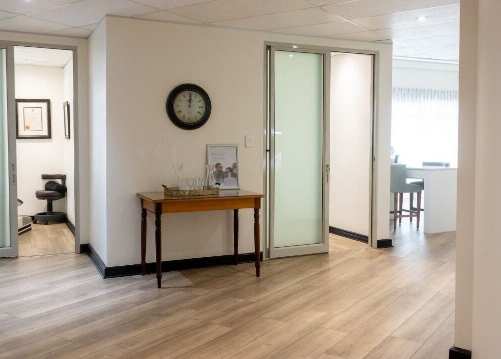Modern interior of Man Sense Waxing Studio in Johannesburg, Gauteng, ZA with sleek wood flooring.