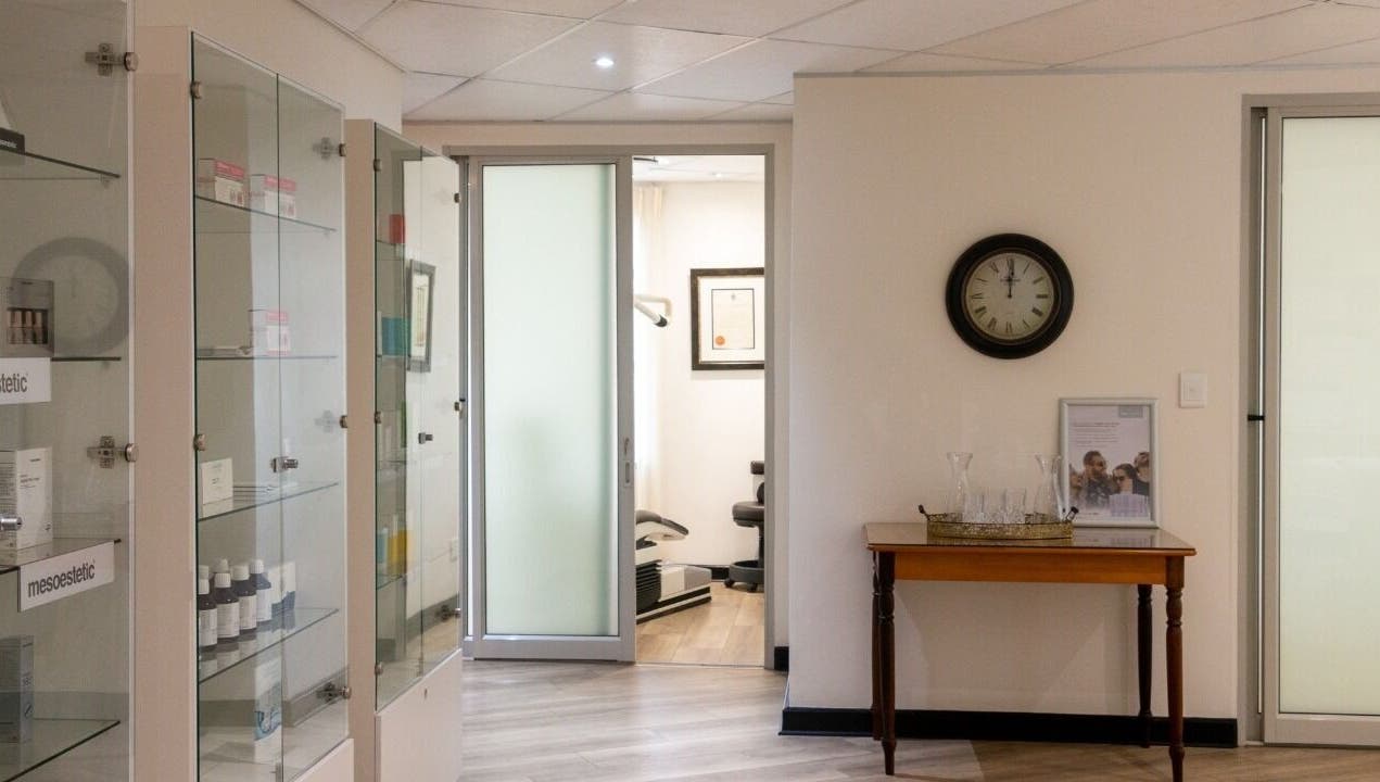 Elegant waiting area at Man Sense Waxing Studio in Johannesburg, Gauteng, ZA featuring glass cabinets and decor.