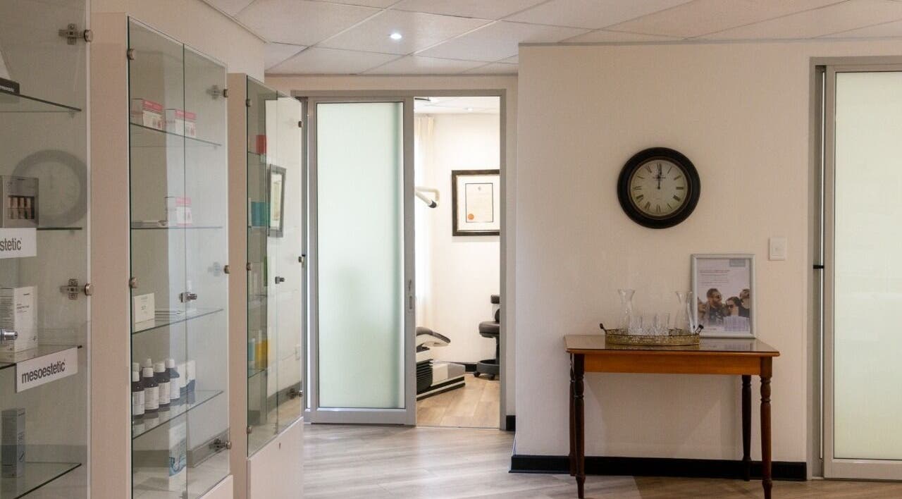 Elegant waiting area at Man Sense Waxing Studio in Johannesburg, Gauteng, ZA featuring glass cabinets and decor.