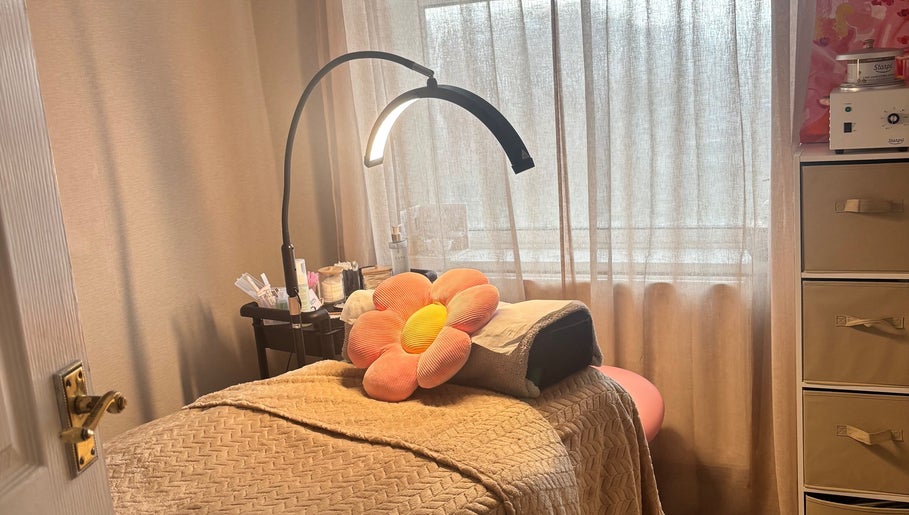 Tranquil treatment room at Brows: By Hazel Bromiley, Chorley, England, GB, featuring a cozy bed and soft lighting.